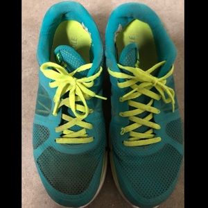 Turquoise and yellow Nike running shoes